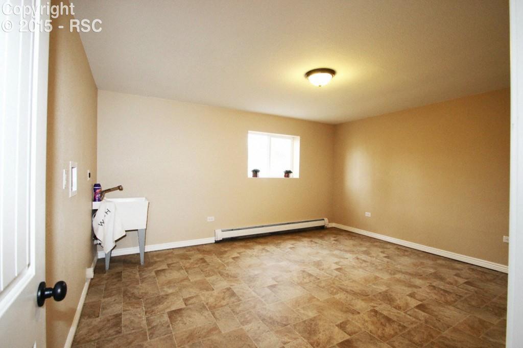 53 Lazy W Road Fountain, CO 80817 - Photo 25 of 31 Basement laundry room with laundry tub.