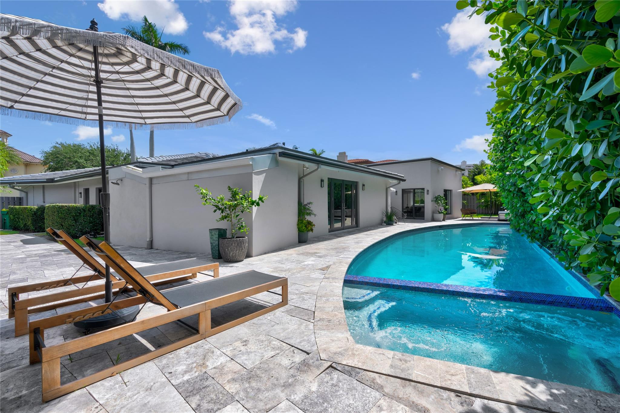 34 Cayuga Road Sea Ranch Lakes, FL 33308 - Photo 7 of 41 Expansive pool & multiple lounge areas