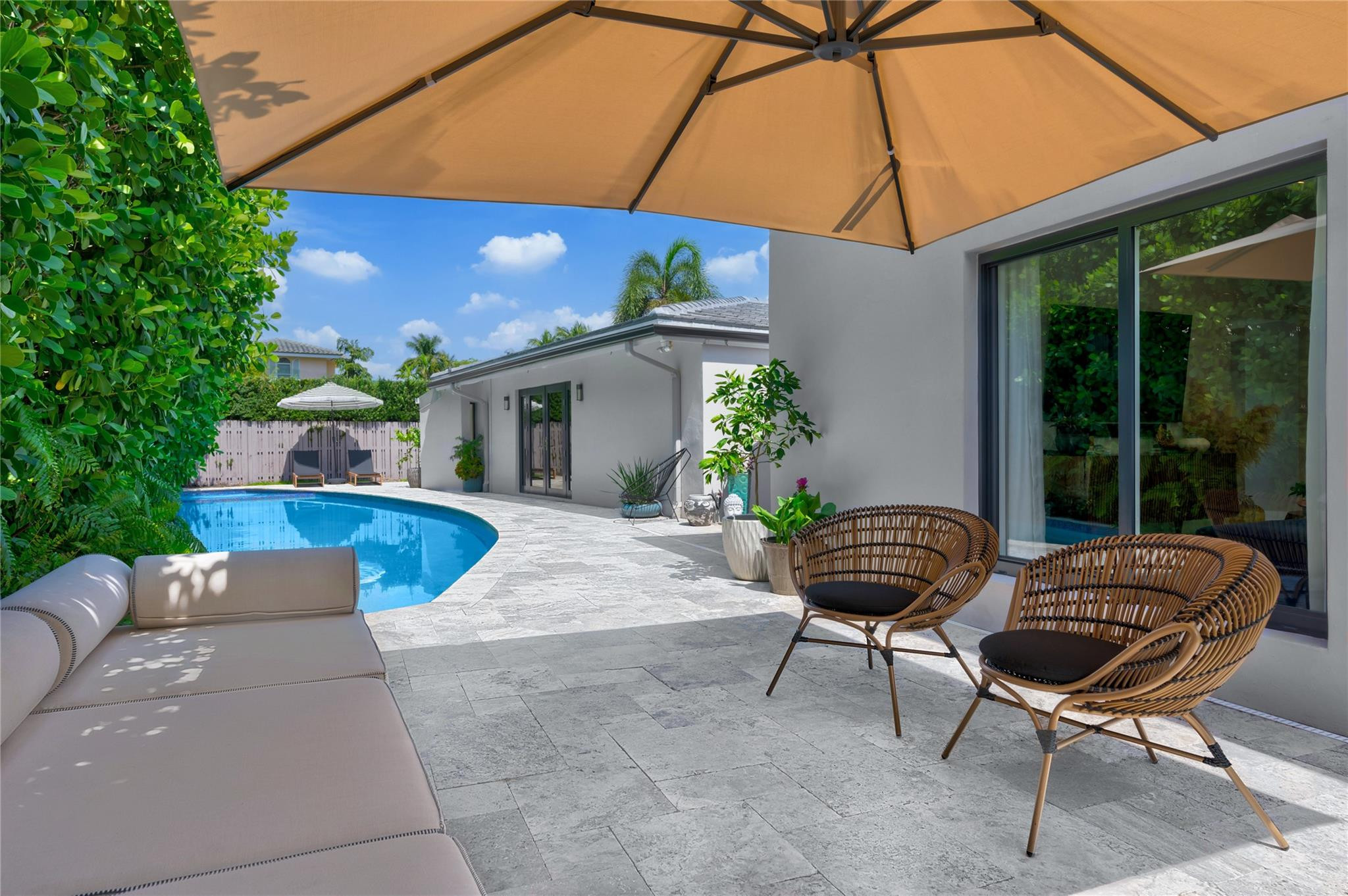 34 Cayuga Road Sea Ranch Lakes, FL 33308 - Photo 8 of 41 Pool side lounge off living space