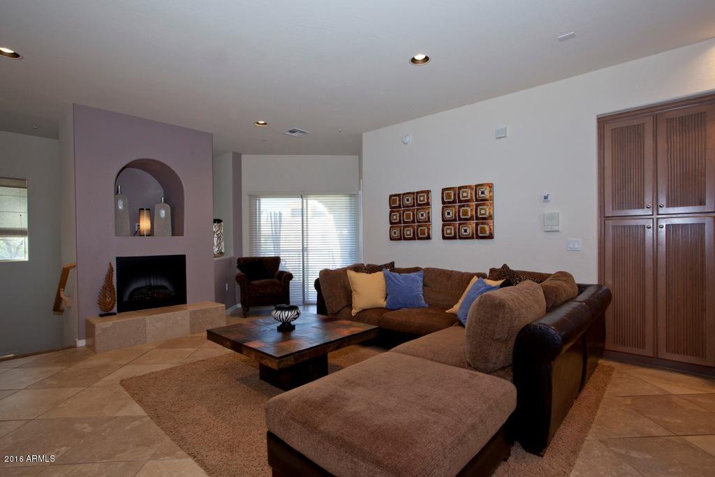 3935 East Rough Rider Road, Unit 1202 Phoenix, AZ 85050 - Photo 12 of 22 Living area w fireplace