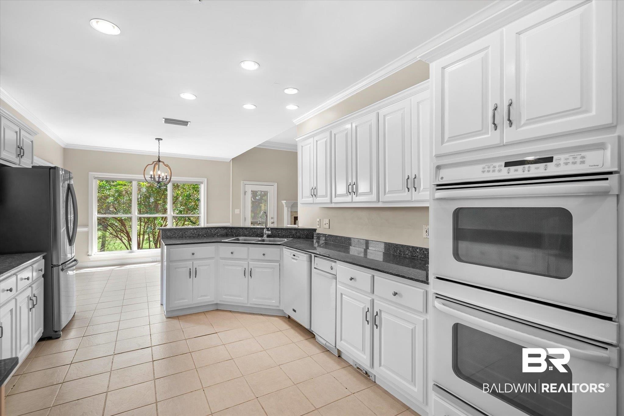 4109 Blue Heron Ridge Mobile, AL 36693 - Photo 9 of 33 Kitchen featuring white cabinetry, crown molding, white appliances, and sink