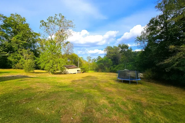 a swimming pool with wooden fence