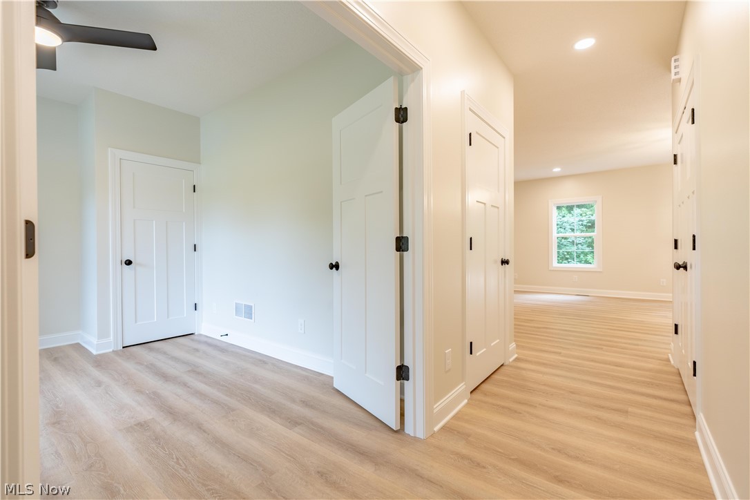 7876 Burkey Road Northwest North Canton, OH 44720 - Photo 11 of 40 First floor hallway outside optional bedroom/office.