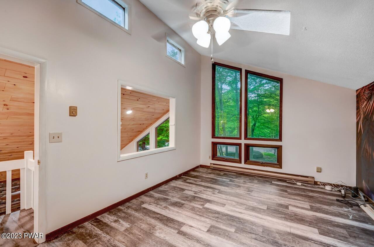 3238 Northgate Road Lake Ariel, PA 18436 - Photo 24 of 49 wooden floor in an empty room with a window