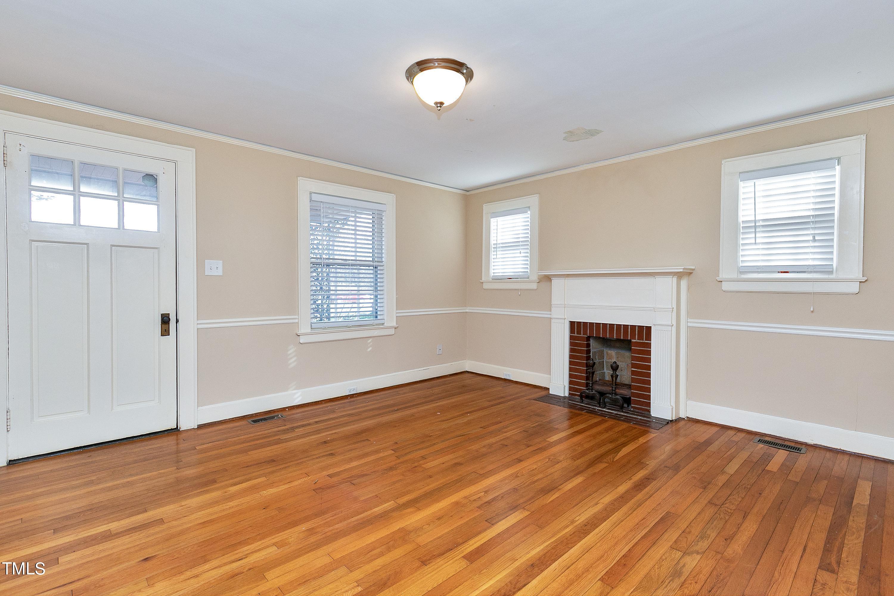 3669 Guess Road Durham, NC 27705 - Photo 6 of 18 Den with Hardwood floors