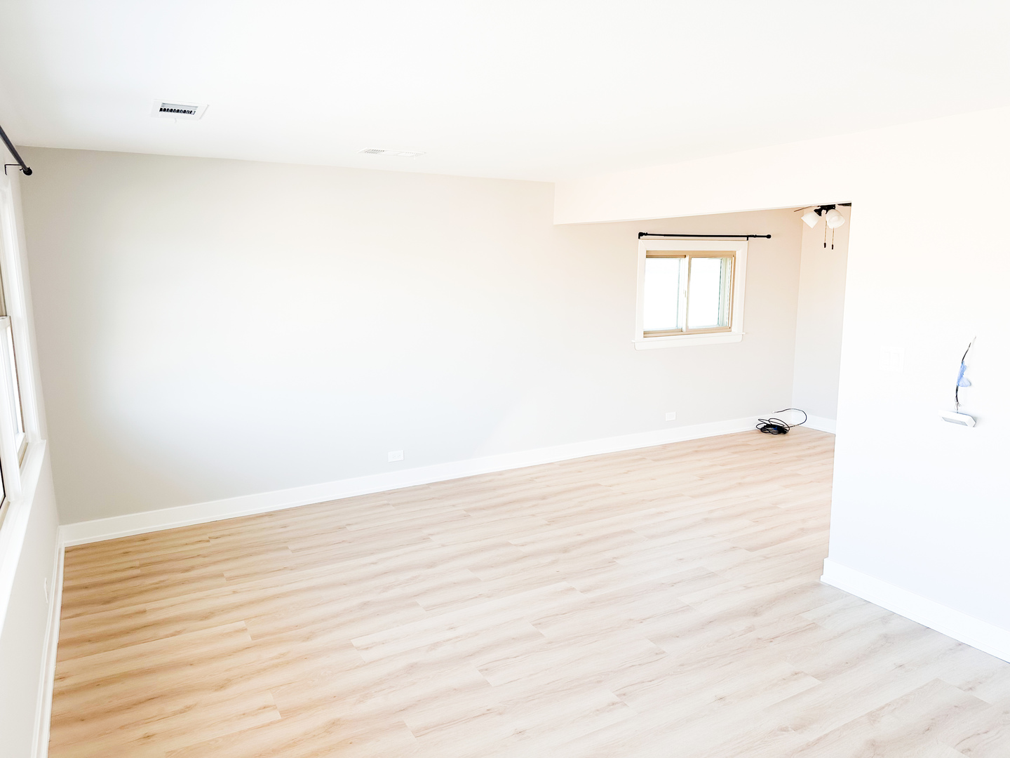 4943 West 63rd Street, Unit 201 Chicago, IL 60638 - Photo 4 of 5 a view of a room with wooden floor