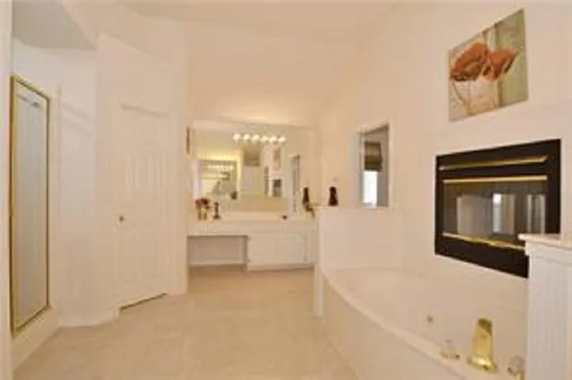 a bathroom with a bathtub and a sink