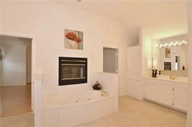 a bathroom with a bathtub and a sink