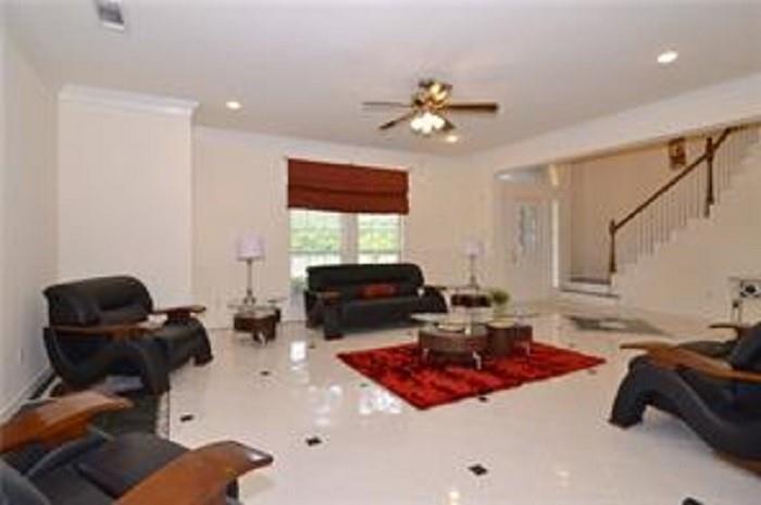 5828 Mossbrook Trail Dallas, TX 75252 - Photo 5 of 25 a living room with furniture and a chandelier