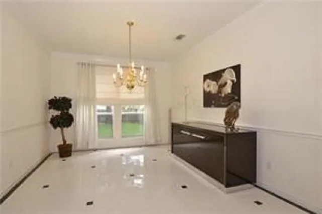 a view of a livingroom with a window and furniture