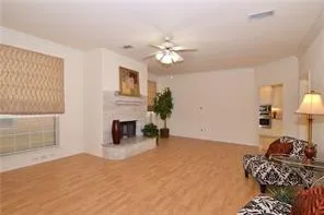 a bedroom with furniture and a fireplace