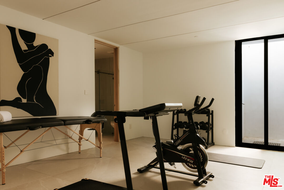 2180 Stradella Road Los Angeles, CA 90077 - Photo 19 of 21 a view of a hallway with furniture and a window