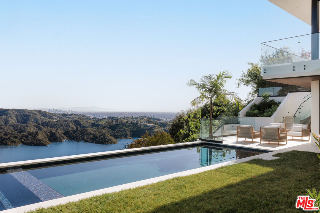 2180 Stradella Road Los Angeles, CA 90077 - Photo 20 of 21 a view of a swimming pool with a terrace