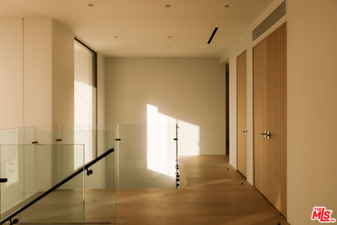 2180 Stradella Road Los Angeles, CA 90077 - Photo 9 of 21 a view of a hallway with painted walls