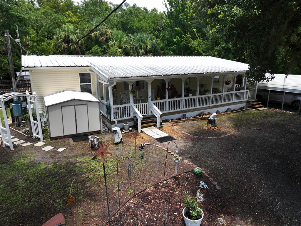 5660 Cypress Drive Yeehaw Junction, FL 34972 - Photo 2 of 36 a house view with a garden space