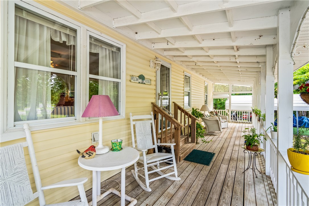 5660 Cypress Drive Yeehaw Junction, FL 34972 - Photo 27 of 36 a view of a dining room with furniture and wooden floor
