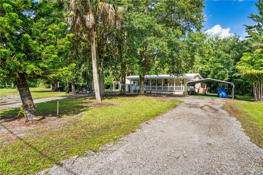 5660 Cypress Drive Yeehaw Junction, FL 34972 - Photo 30 of 36 a view of a park with large trees