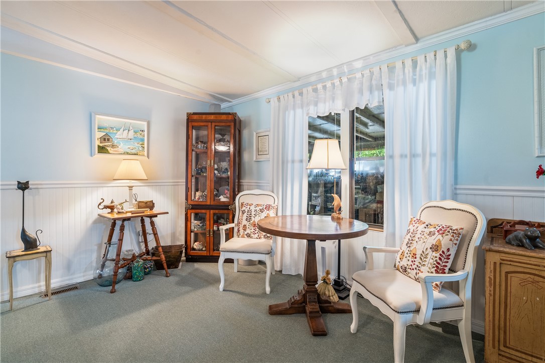 5660 Cypress Drive Yeehaw Junction, FL 34972 - Photo 7 of 36 a living room with furniture and a window