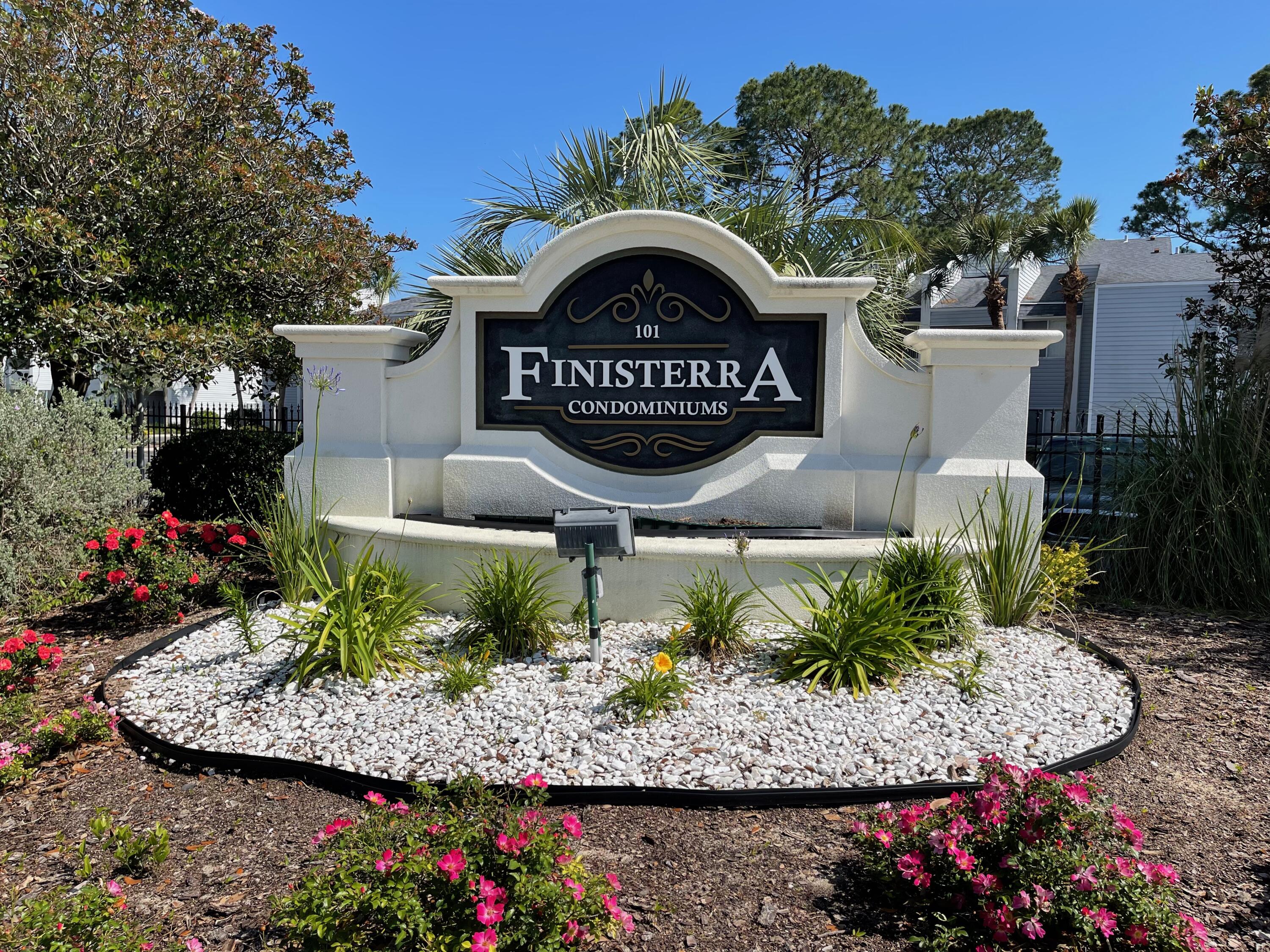 101 Old Ferry Road, Unit 8A Shalimar, FL 32579 - Photo 1 of 22 a view of a sign in front of flowers