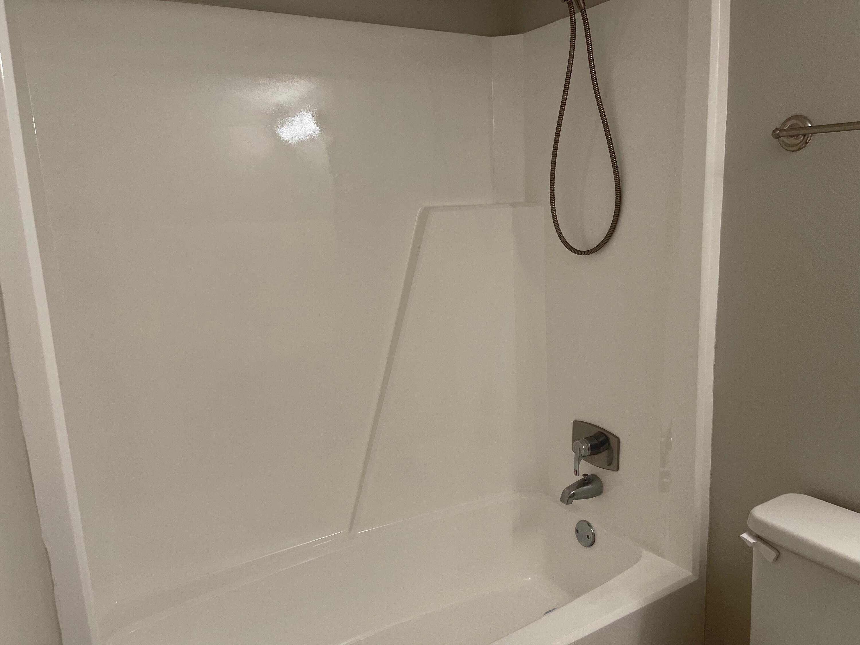 101 Old Ferry Road, Unit 8A Shalimar, FL 32579 - Photo 12 of 22 a bathroom with a bath tub with a shower
