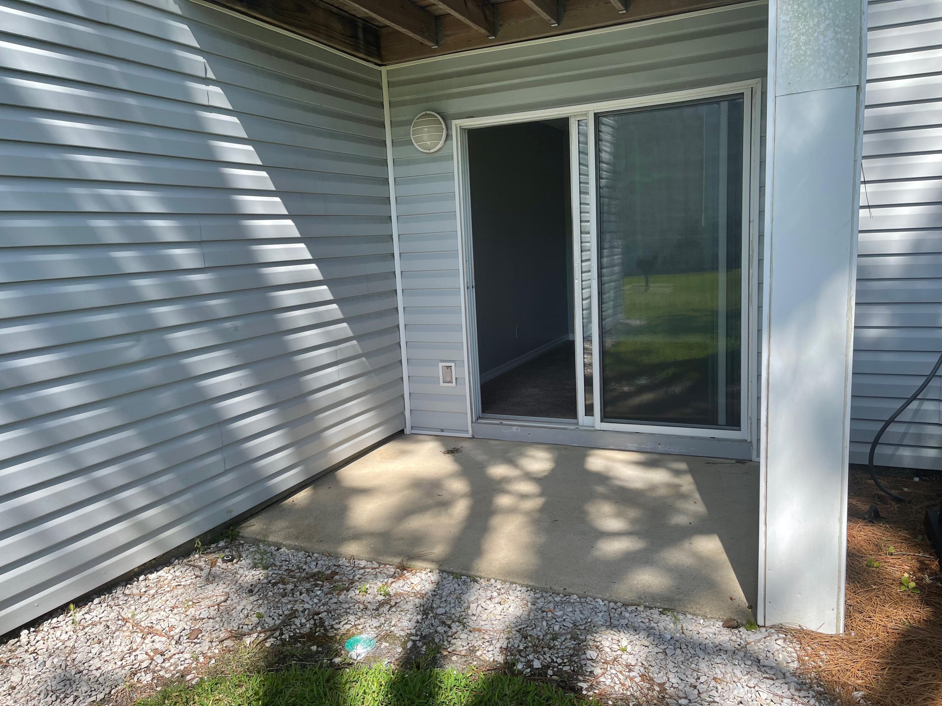 101 Old Ferry Road, Unit 8A Shalimar, FL 32579 - Photo 16 of 22 a view of backyard of a house