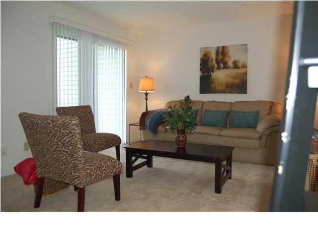 101 Old Ferry Road, Unit 8A Shalimar, FL 32579 - Photo 4 of 22 a living room with furniture and a window