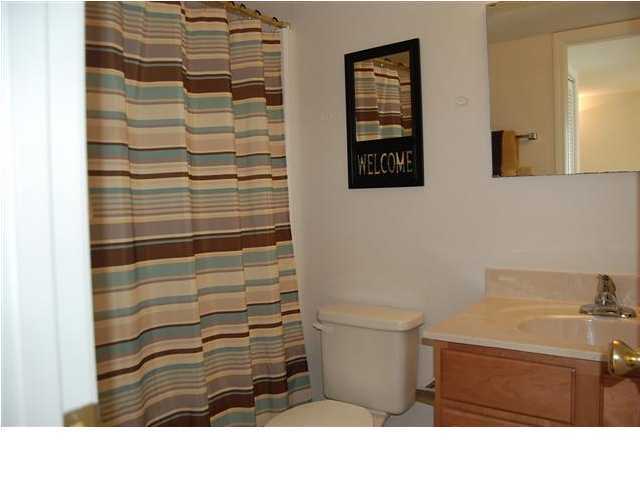101 Old Ferry Road, Unit 8A Shalimar, FL 32579 - Photo 9 of 22 a bathroom with a toilet and a shower
