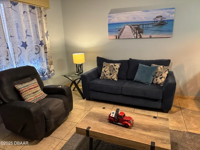 a living room with furniture and a couch