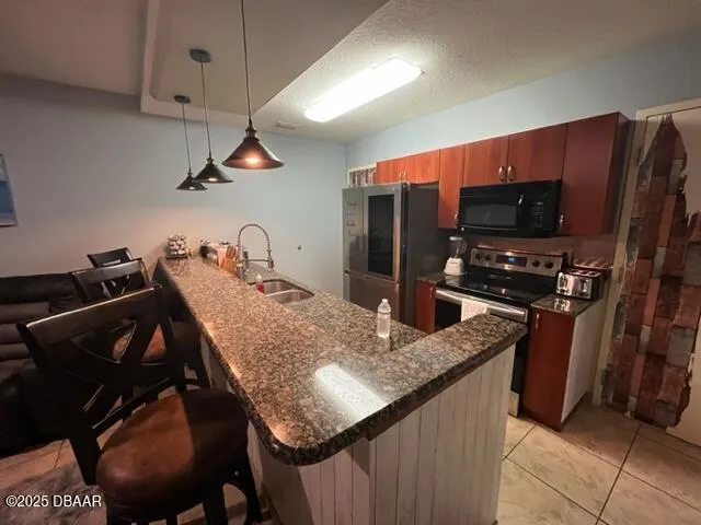 a kitchen with appliances cabinets and furniture