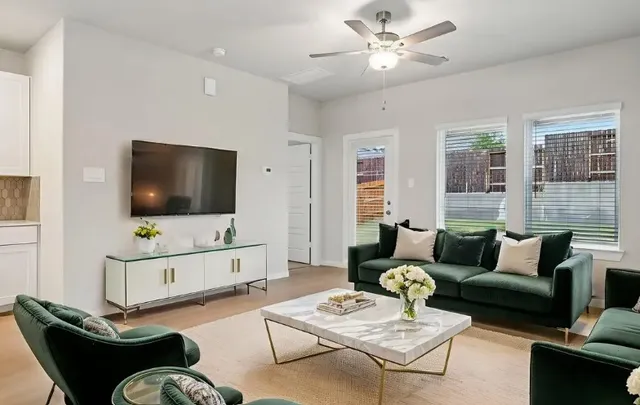 a living room with furniture and a flat screen tv
