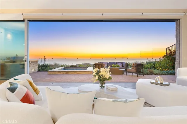 a spacious bedroom with a bed and a wall painting