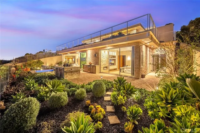 a bathroom with a granite countertop sink a toilet and a shower