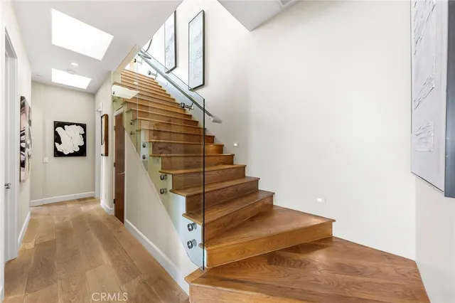 a living room with furniture fireplace and a large window