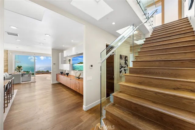 a living room with patio furniture and a large window