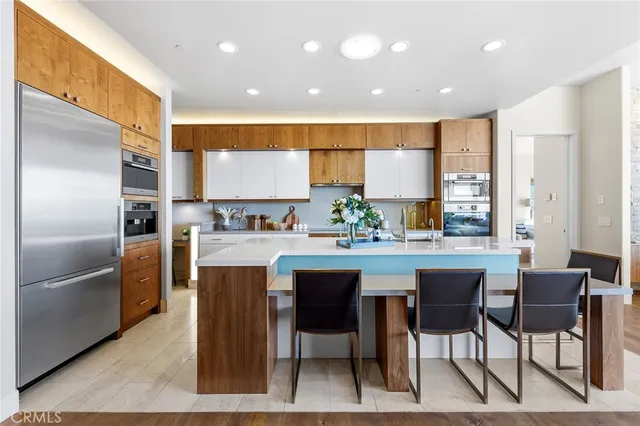 a spacious bathroom with a double vanity sink and mirror