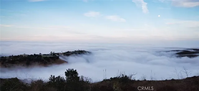 a view of sunset and a mountain
