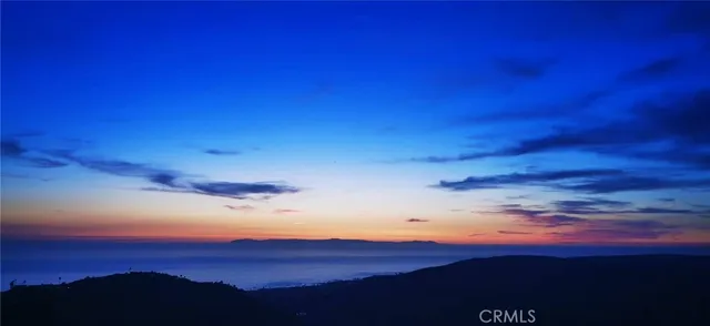 a view of a terrace with furniture and a fire pit