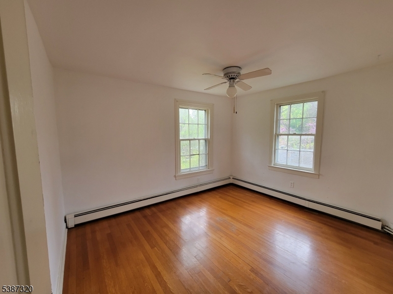 504 3rd Street Belvidere, NJ 07823 - Photo 12 of 13 a view of an empty room with wooden floor and a window