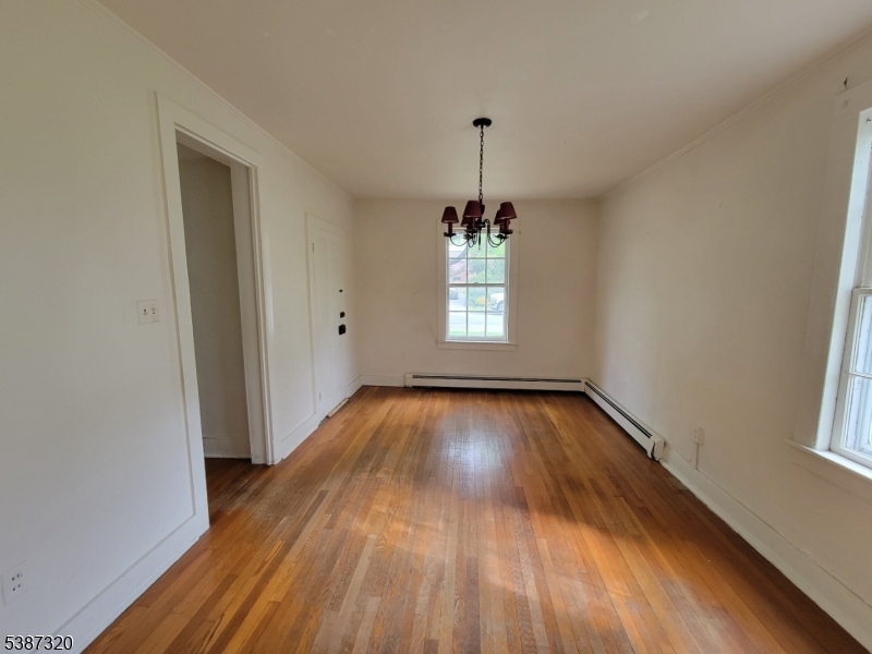 504 3rd Street Belvidere, NJ 07823 - Photo 5 of 13 a view of empty room with window and wooden floor