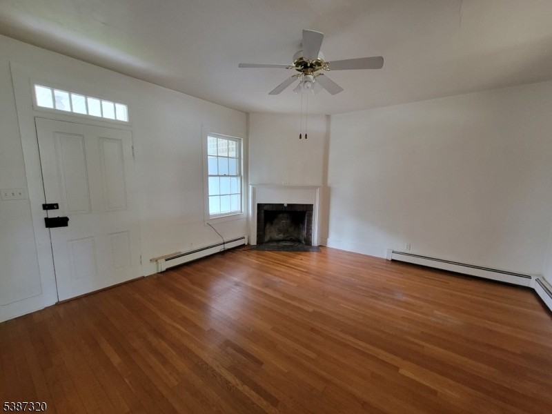 504 3rd Street Belvidere, NJ 07823 - Photo 6 of 13 wooden floor in an empty room with a window