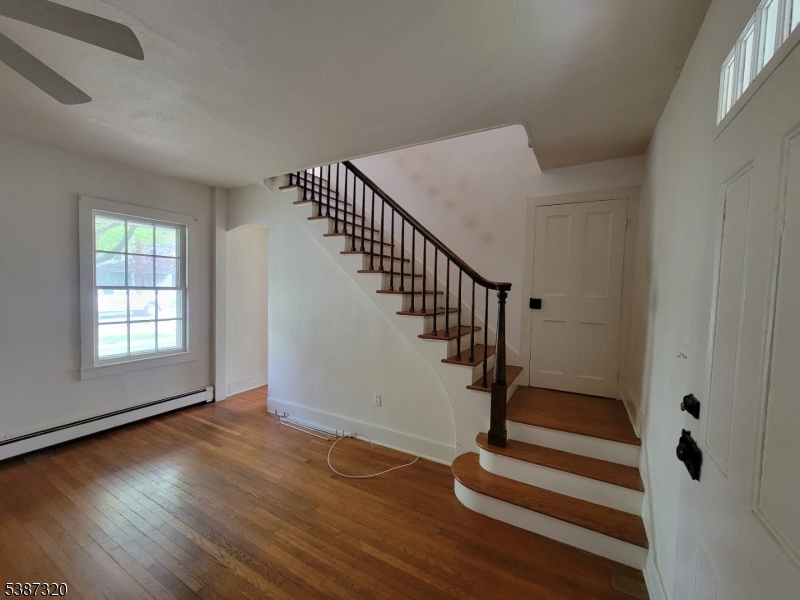 504 3rd Street Belvidere, NJ 07823 - Photo 7 of 13 a view of entryway with wooden floor and stairs
