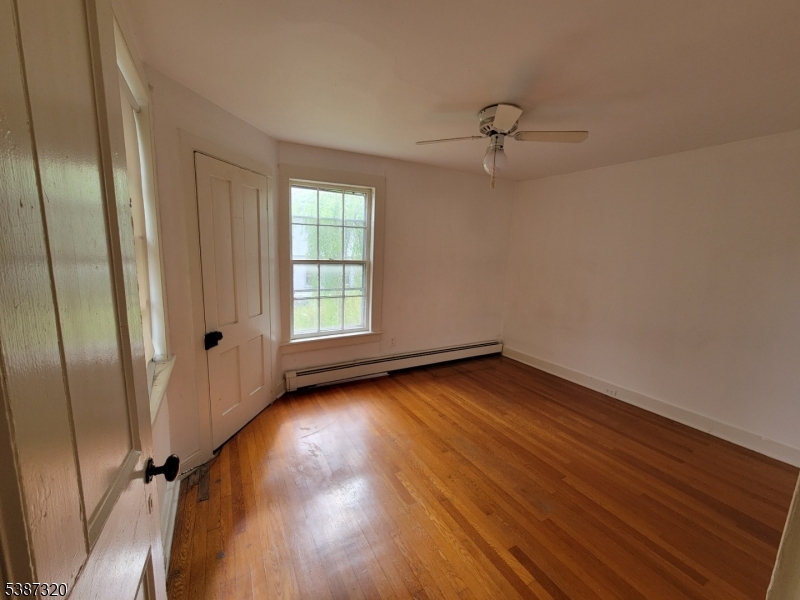 504 3rd Street Belvidere, NJ 07823 - Photo 8 of 13 wooden floor in an empty room with a window