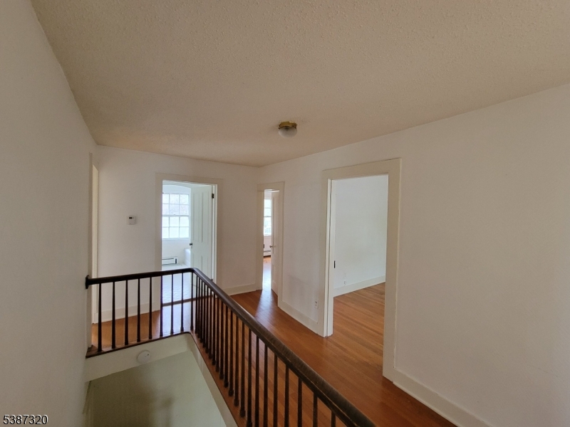 504 3rd Street Belvidere, NJ 07823 - Photo 9 of 13 a view of a hallway with wooden floor