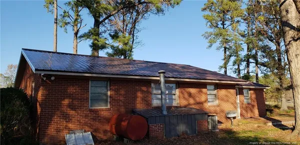 a view of a house with a tree