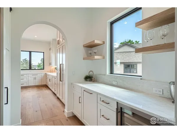 a spacious bathroom with a double vanity sink and a mirror