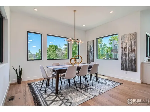a dining room with furniture window wooden floor
