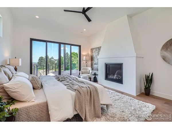 a bedroom with a bed and a fireplace