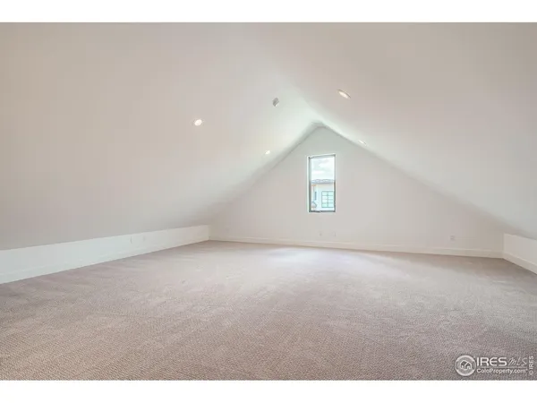 a view of an empty room and a window