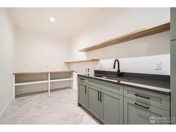 a kitchen with a sink and wooden cabinets