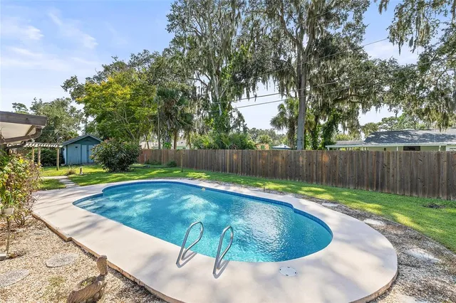 a view of a swimming pool with a patio